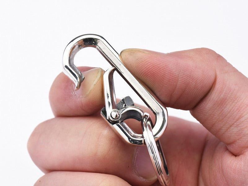 Roll pin carabiner with gate spike