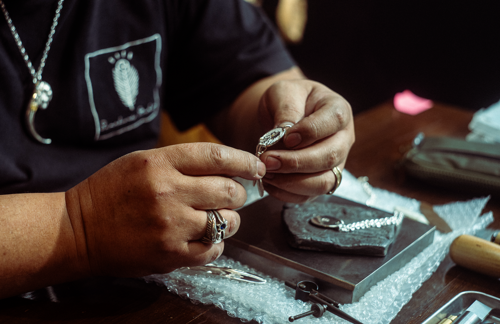 Sunshine Studio artisan demonstrating handmade silver jewellery techniques